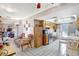 Eat-in kitchen featuring tiled floor, white appliances, and access to the living room at 2622 11Th W Ave, Bradenton, FL 34205