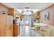 Eat-in kitchen featuring tiled floor, stainless steel appliances, and wood cabinets at 2622 11Th W Ave, Bradenton, FL 34205