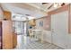 Eat-in kitchen featuring tiled floor, white appliances, and access to the backyard at 2622 11Th W Ave, Bradenton, FL 34205