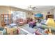 Cozy living room with wicker furniture, neutral paint, and large television at 2622 11Th W Ave, Bradenton, FL 34205