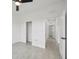 Bedroom with closet, tile floors, a ceiling fan, and an open doorway to other rooms at 2794 Escambia Cir, North Port, FL 34288