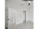 Bedroom featuring tile flooring, closet, and a view into the adjacent rooms at 2794 Escambia Cir, North Port, FL 34288
