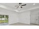 Bright bedroom with sliding glass doors and neutral color palette at 2794 Escambia Cir, North Port, FL 34288