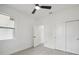 Bright bedroom featuring a ceiling fan, window, and closet space, ready for personalization at 2794 Escambia Cir, North Port, FL 34288