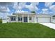 Charming single-Gathering home featuring manicured lawn and a contemporary design at 2794 Escambia Cir, North Port, FL 34288