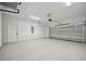 Spacious two-car garage with epoxy flooring, bright lighting, and ample room for parking and storage at 2794 Escambia Cir, North Port, FL 34288