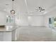 Bright, open-concept living space with sleek flooring, kitchen island and lots of light at 2794 Escambia Cir, North Port, FL 34288