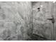 Modern shower with marble-look tile and sleek fixtures, creating a spa-like experience at 2794 Escambia Cir, North Port, FL 34288