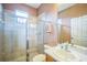 Bathroom with a glass-enclosed shower, tile flooring, and a sink vanity at 3041 Stonegate Falls Dr, Land O Lakes, FL 34638