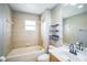 Bathroom featuring a bathtub, tile flooring, vanity, and updated fixtures at 3041 Stonegate Falls Dr, Land O Lakes, FL 34638
