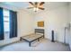 Minimalist bedroom featuring carpet flooring, natural light, and a sleek modern design at 3041 Stonegate Falls Dr, Land O Lakes, FL 34638