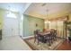 Formal dining room with elegant decor, stylish lighting, and ample space for entertaining guests at 3041 Stonegate Falls Dr, Land O Lakes, FL 34638