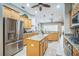 Well-equipped kitchen featuring granite countertops, stainless steel appliances, and a center island at 3041 Stonegate Falls Dr, Land O Lakes, FL 34638