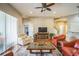 Inviting living room with hardwood floors, comfortable seating, and a cozy fireplace at 3041 Stonegate Falls Dr, Land O Lakes, FL 34638