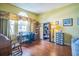 Bright home office with hardwood floors, desk, and window with a view at 3041 Stonegate Falls Dr, Land O Lakes, FL 34638