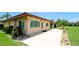 Charming home featuring a well-maintained yard, beautiful landscaping, and a spacious patio area at 3305 Notre Dame Pl # 3305, Bradenton, FL 34207