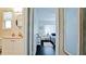 Inviting bathroom transitioning to a bedroom showcasing warm natural light and stylish furniture at 3305 Notre Dame Pl # 3305, Bradenton, FL 34207