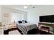 Cozy bedroom featuring a comfortable bed, dark wood floor, and a relaxing sitting area at 3305 Notre Dame Pl # 3305, Bradenton, FL 34207