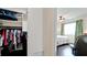 Bright closet with an organized wardrobe and shelves, connecting to a bedroom with natural light at 3305 Notre Dame Pl # 3305, Bradenton, FL 34207