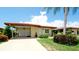 Charming single-story home with a terracotta tile roof, covered carport, and well-manicured landscaping at 3305 Notre Dame Pl # 3305, Bradenton, FL 34207