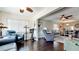Spacious living room with comfortable seating, a ceiling fan, dark wood floors, and view to open dining area at 3305 Notre Dame Pl # 3305, Bradenton, FL 34207