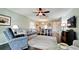 Open-concept living room seamlessly flows into dining area, featuring dark wood floors and stylish decor at 3305 Notre Dame Pl # 3305, Bradenton, FL 34207
