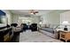 Spacious living area with hardwood floors, neutral tones, and comfortable seating arrangements at 3305 Notre Dame Pl # 3305, Bradenton, FL 34207