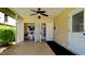 Large covered patio with storage closets revealing ample space and a bicycle at 3305 Notre Dame Pl # 3305, Bradenton, FL 34207