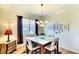 Chic dining room boasts modern lighting, stylish decor, and ample natural light at 362 Fairway Isles Ln, Bradenton, FL 34212