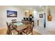 Open dining area with breakfast bar and updated decor provides a lovely space for meals and gatherings at 362 Fairway Isles Ln, Bradenton, FL 34212