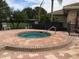 Community hot tub surrounded by a brick paver patio for residents to enjoy at 362 Fairway Isles Ln, Bradenton, FL 34212