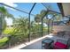 Enjoy outdoor living on this screened lanai overlooking lush tropical landscaping at 362 Fairway Isles Ln, Bradenton, FL 34212