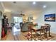 Open-concept living room connects to the dining area with views of the lanai, creating a spacious layout at 362 Fairway Isles Ln, Bradenton, FL 34212