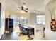 Sunlit office space features a ceiling fan, plantation shutters, and modern track lighting for a professional look at 362 Fairway Isles Ln, Bradenton, FL 34212
