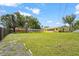 A huge backyard including a sitting area at 409 Archibald Ave, Sarasota, FL 34243
