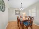 Formal dining room with a wooden table, seating for six, and a chandelier at 409 Archibald Ave, Sarasota, FL 34243
