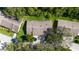 Aerial view of a home with a well-manicured lawn and mature trees at 4279 Oakhurst E Cir # 3044, Sarasota, FL 34233