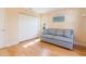 Bedroom featuring a sofa, a closet, and hardwood floors at 4279 Oakhurst E Cir # 3044, Sarasota, FL 34233