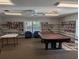Bright common room featuring a pool table and bookshelves at 4279 Oakhurst E Cir # 3044, Sarasota, FL 34233