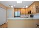 Bright kitchen with stainless steel appliances and quartz countertops at 4279 Oakhurst E Cir # 3044, Sarasota, FL 34233