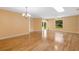 Bright living room with hardwood floors, natural light, and a ceiling fan at 4279 Oakhurst E Cir # 3044, Sarasota, FL 34233