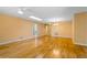 Large living room with beautiful hardwood floors, skylight, and neutral paint at 4279 Oakhurst E Cir # 3044, Sarasota, FL 34233