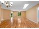 Bright living room boasts hardwood floors, natural light, and a ceiling fan at 4279 Oakhurst E Cir # 3044, Sarasota, FL 34233