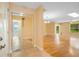 Bright and airy living room showcasing beautiful hardwood floors, skylight, and spacious open layout at 4279 Oakhurst E Cir # 3044, Sarasota, FL 34233