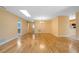 Spacious living room featuring hardwood floors and a skylight for ample natural light at 4279 Oakhurst E Cir # 3044, Sarasota, FL 34233