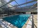 A large screened in pool with clear blue water provides a relaxing escape year round at 4279 Oakhurst E Cir # 3044, Sarasota, FL 34233