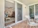 Relaxing balcony with seating, open to the living area, offering serene views of the outdoor living area at 4325 Gulf Of Mexico Dr # 204, Longboat Key, FL 34228