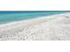 Sandy beachfront with gentle waves, perfect for a relaxing coastal retreat at 4325 Gulf Of Mexico Dr # 204, Longboat Key, FL 34228