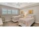 Bedroom features two twin beds, a ceiling fan, and a window with blinds at 4325 Gulf Of Mexico Dr # 204, Longboat Key, FL 34228