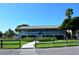 Exterior of the community clubhouse showing the manicured front lawn and an inviting entrance at 4325 Gulf Of Mexico Dr # 204, Longboat Key, FL 34228